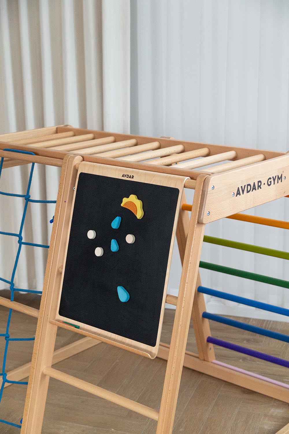 A rainbow climber hanged with a magnet blackboard