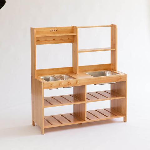 Wooden play kitchen with sinks and shelves, equipped with stainless steel trays and cups.
