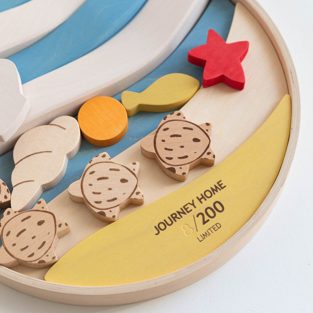 A limited wooden puzzle toy featuring colorful layers and turtle figures on a round carrying tray.