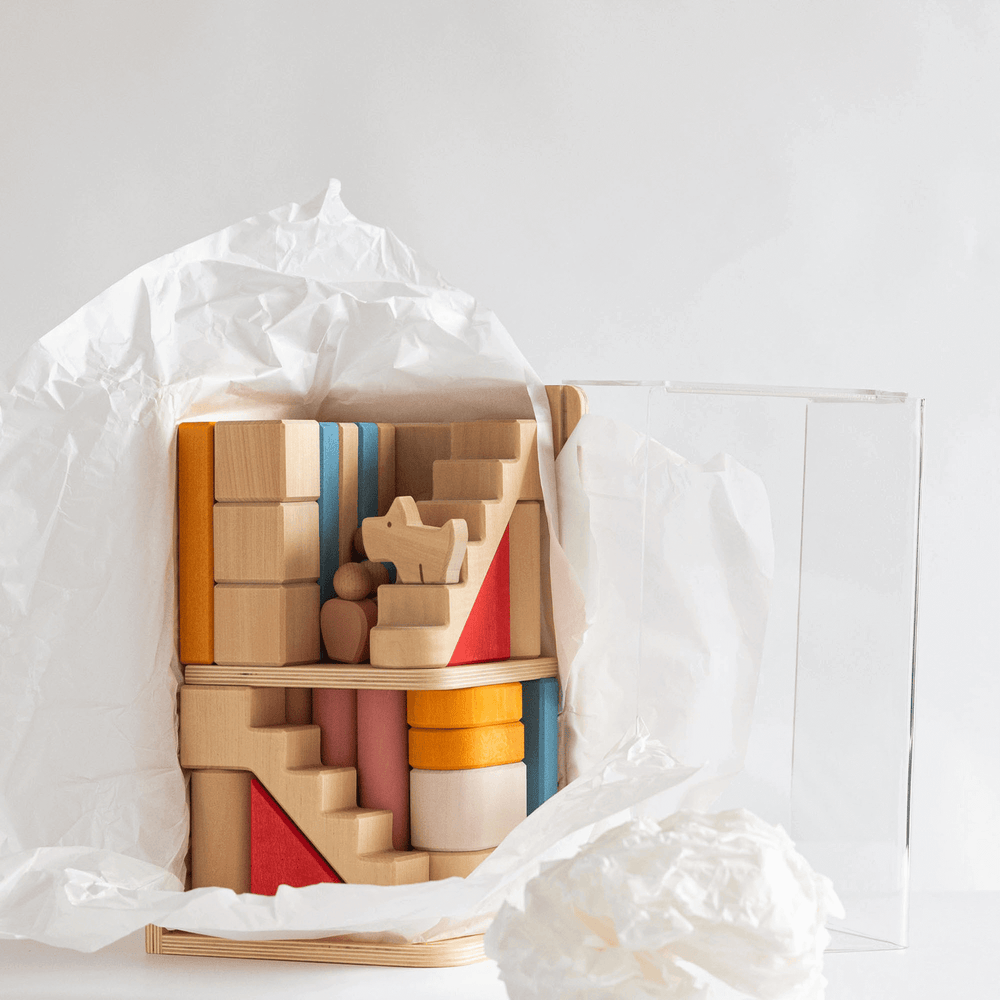 Multi-floor block set packaged the blocks with white paper on a light background