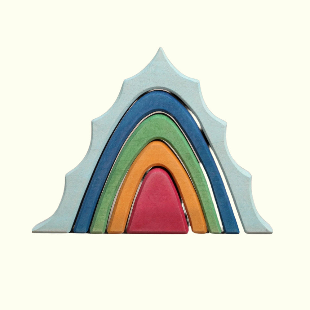 A set of five colorful, mountain-shaped toy blocks stacked in a cascade, with colors including blue, green, orange, red, and purple.