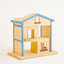 A wooden dollhouse with a blue roof, featuring two stories, an attic, and a balcony. It has a rotating platform, sliding doors, and a ladder.
