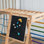 A rainbow climber hanged with a magnet blackboard