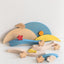 The display of the elements of the wooden puzzle toy featuring colorful layers and turtle figures on a round carrying tray.