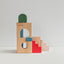 Colorful wooden building blocks and staircase blocks on a light gray background