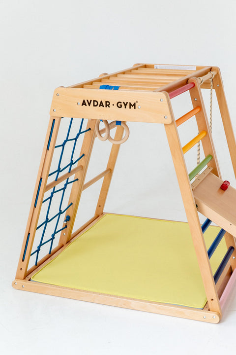 Wooden and multifunctional climber with colorful and rope ladder and slope