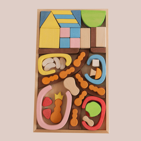 A wooden ant block set designed to represent an ant house, with various shaped pieces displayed in a  wooden box